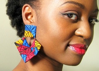 Woman wearing Afrocentric earrings